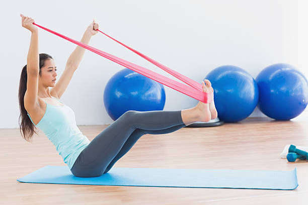 Using resistance bands for a versatile workout in a budget-friendly home gym.
